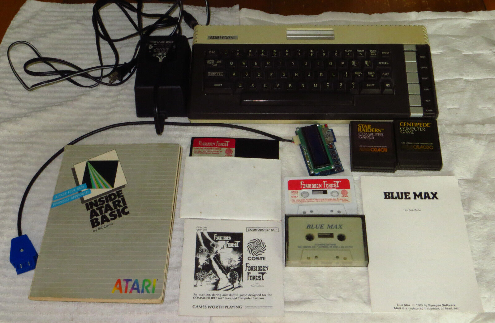 Atari 600XL microcomputer lot with games, manuals - please see description