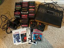 Atari 2600 console, 34 games, 23 manuals, 2 joysticks 2 paddles - all untested picture