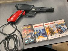 Vintage Commodore 64 Cheetah Defender 64 Light Gun with 4 games on tape. picture