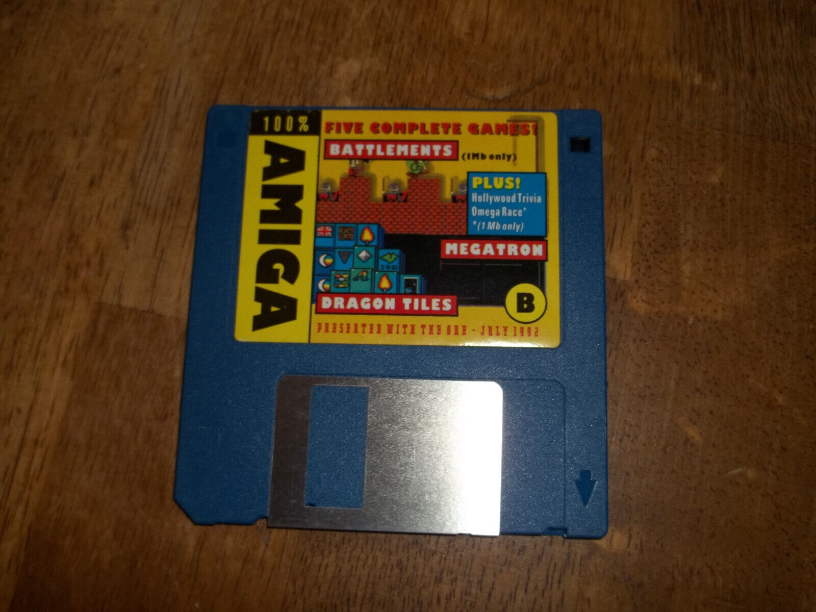 Commodore Amiga disk with 3 games on it. Battlements, Megatron and Dragon Tiles