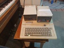 apple 2e Vintage computer system . two disk drives, manuals picture
