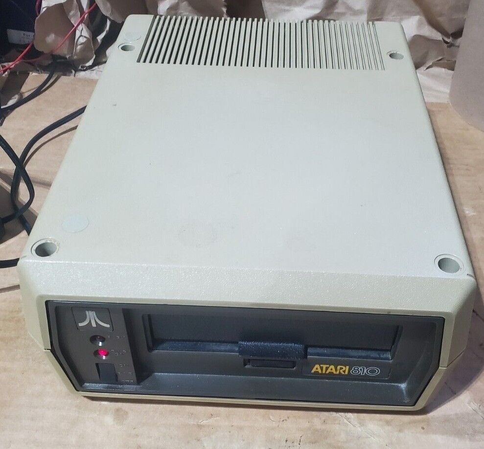 Vintage Atari 810 Disk Drive. Powers on. Very Clean with power supply.