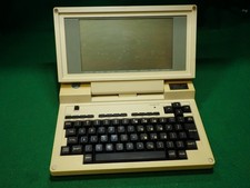 Vintage Tandy 200 Portable Computer with plastic travel sleeve, no power supply picture