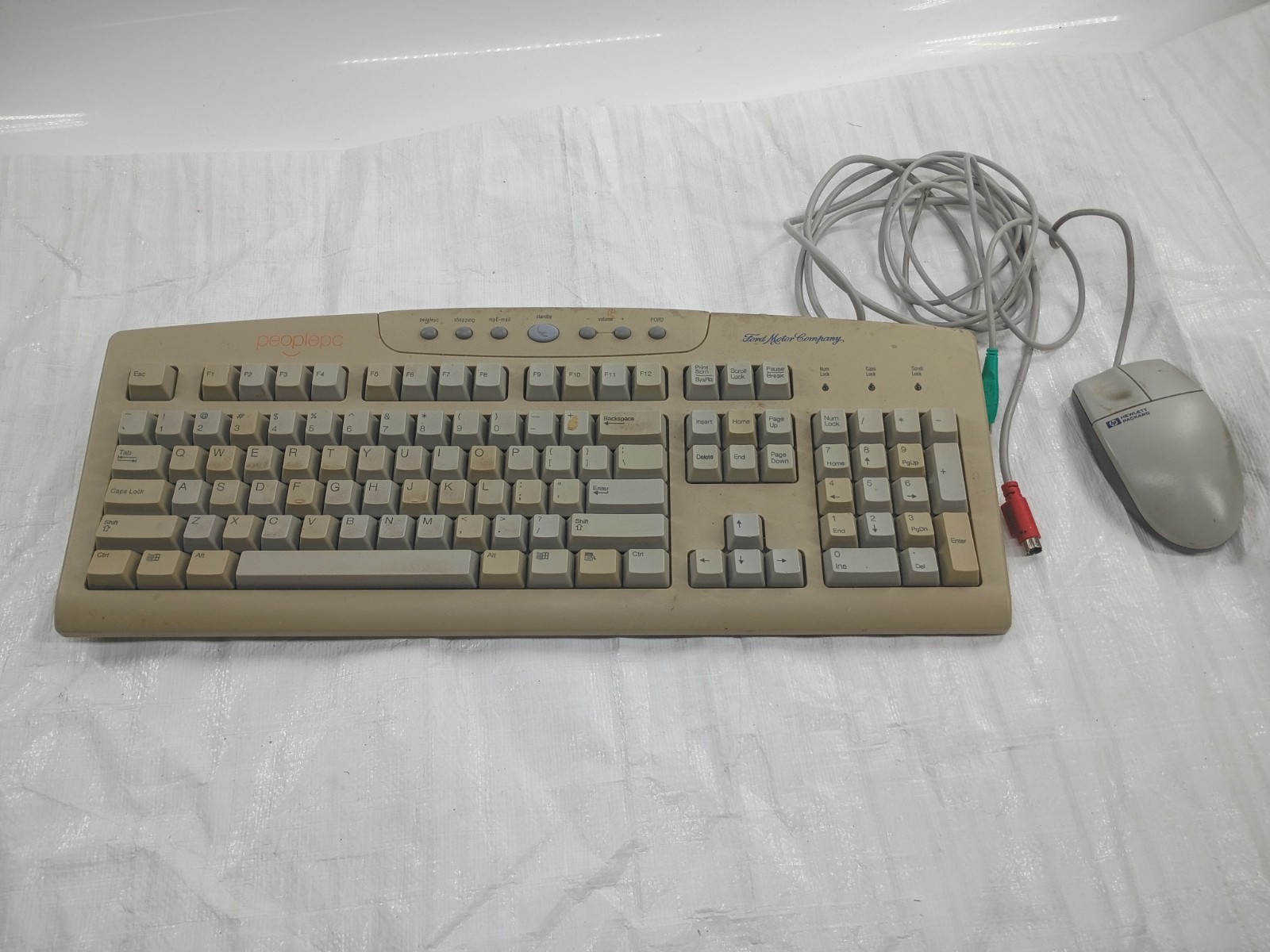 Vintage Ford Motor Company PeoplePC keyboard with HP wired mouse. Vintage Ford Motor Company PeoplePC keyboard with HP wired mouse.