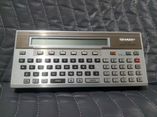 Vintage SHARP PC-1500 Pocket Computer Scientific Calculator POWERS ON, UNTESTED picture