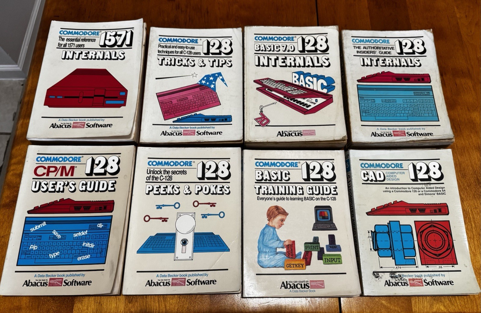 Abacus Software Commodore 128 C-128 Book Lot 8 BASIC 7.0 CP/M CAD Manuals Abacus Software Commodore 128 C-128 Book Lot 8 BASIC 7.0 CP/M CAD Manuals